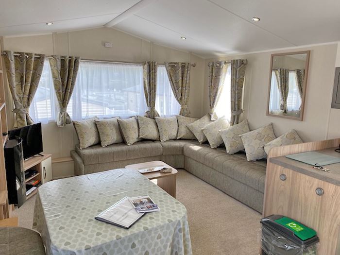 Elevated Willerby Rio Premier for hire on the edge of 'Orange Park' at Waterside Holiday Park